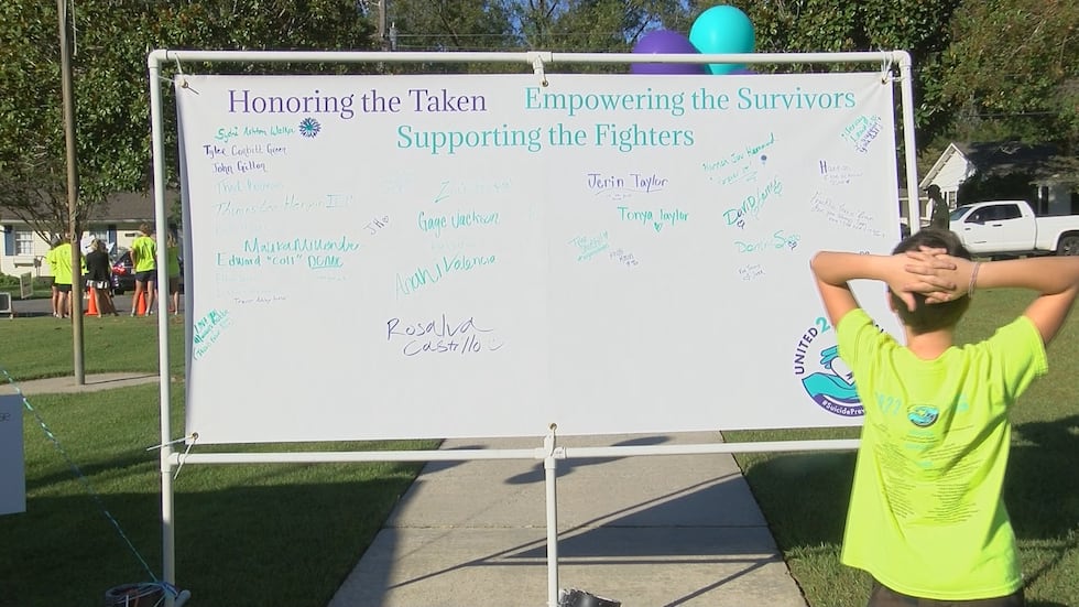 Over 30 names of people impacted by suicide were written on a banner to remember them.