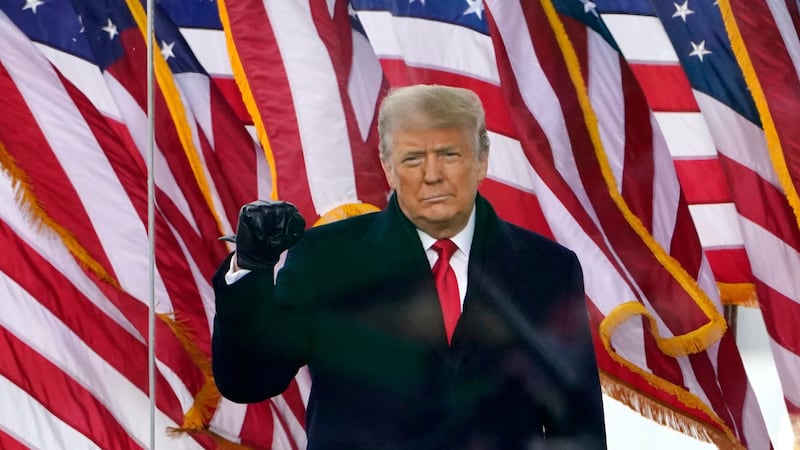 President Donald Trump gestures as he arrives to speak at a rally on Jan. 6, 2021, in...