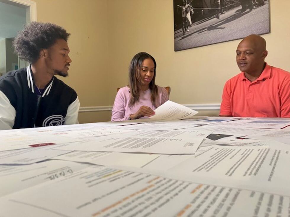 Regis Harris with his mother and father