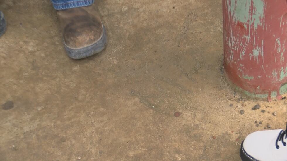 Marlena's family looks back at the initials she traced in the concrete.