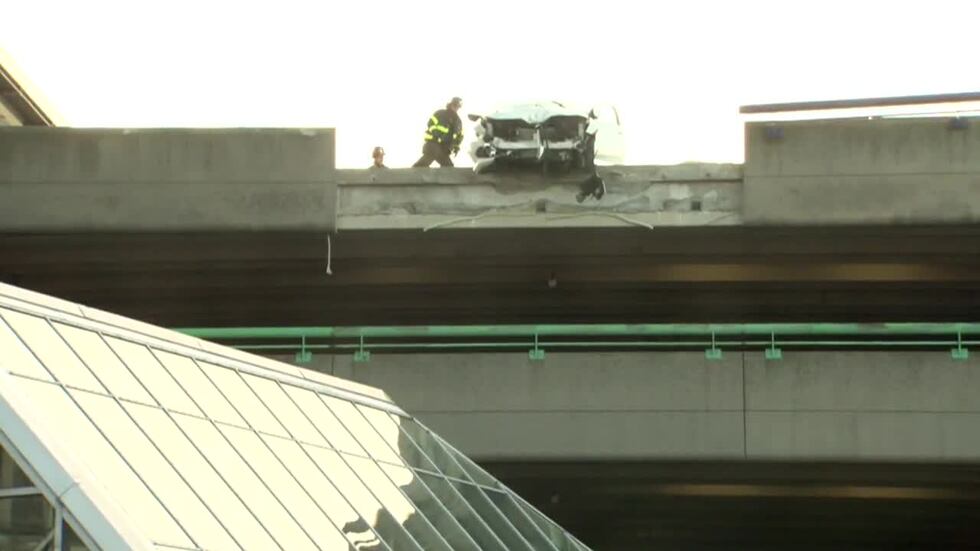 A car crashed into a parking garage barrier, sending debris crashing into the train station...